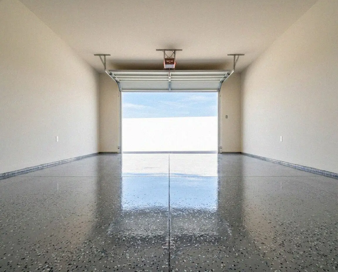 A sealed concrete garage floor in a Fontana home, joints sawn square